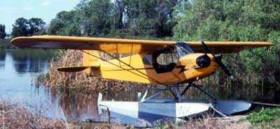 Piper J-3 Cub on floats parked